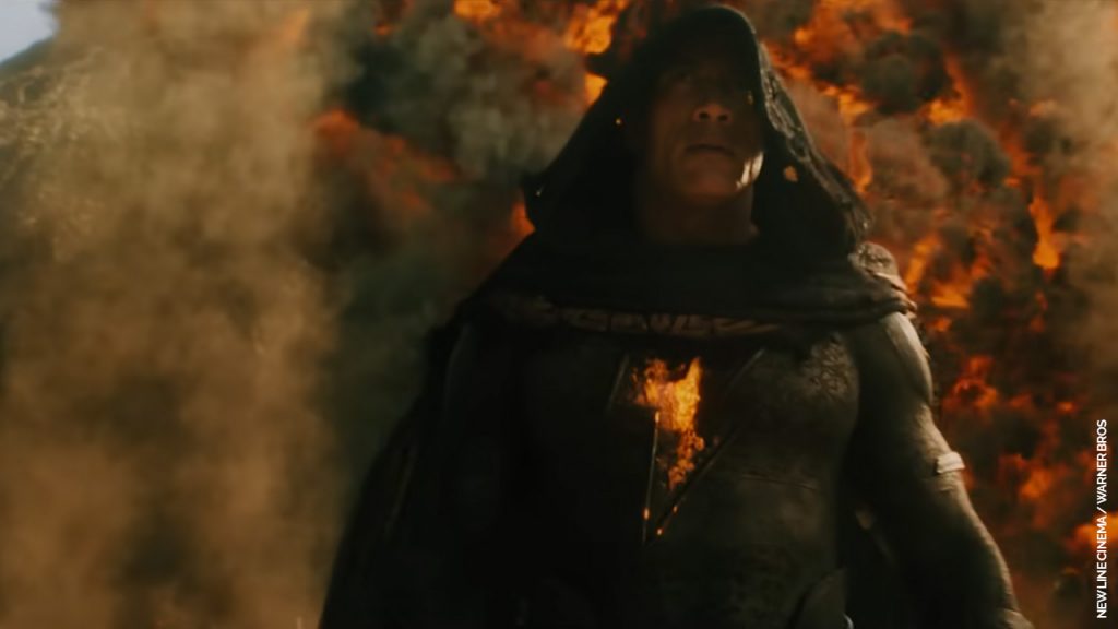 Dwayne Johnson does the walking-away-from-explosion strut in Black Adam (2022). (New Line/Warner Bros)