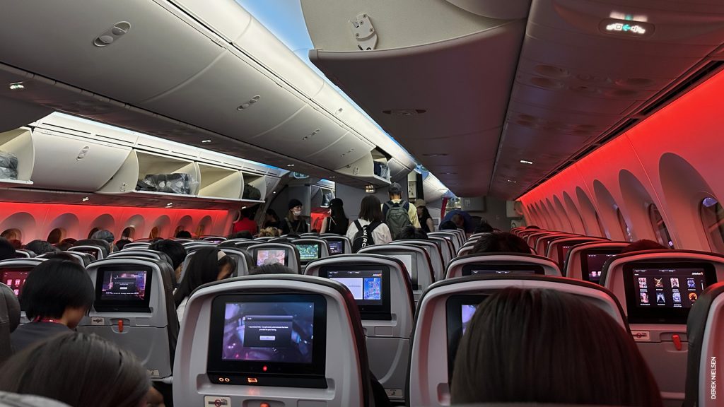 The view from inside the Economy Class cabin on the 787, with orange 'mood lighting' (Jetstar's brand colour is orange). 